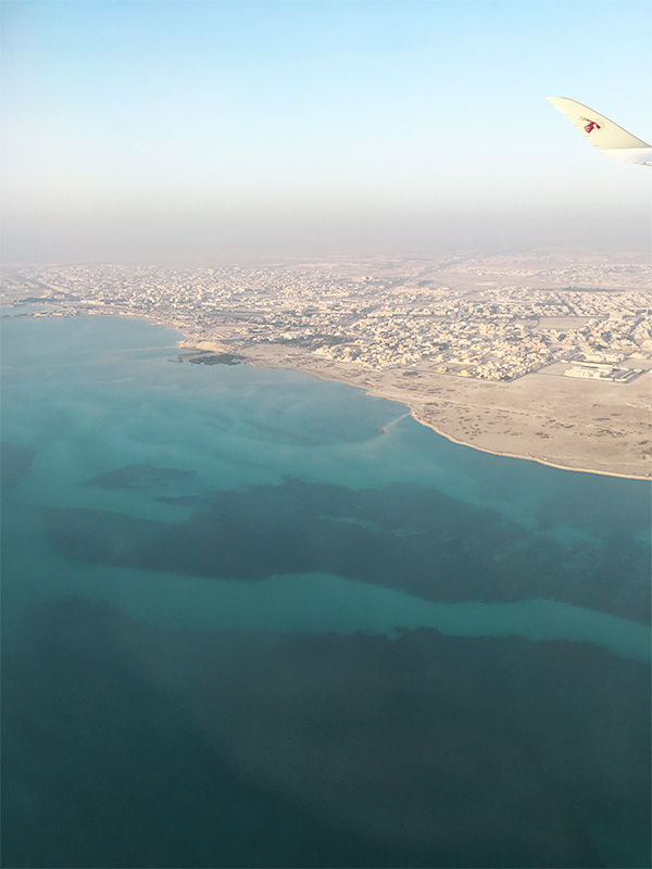 flying into hamad airport over the persian gulf