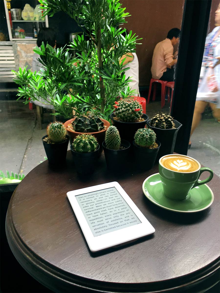 reading nook and cappuccino at the bangkok espresso bar in ari bangkok the food quest