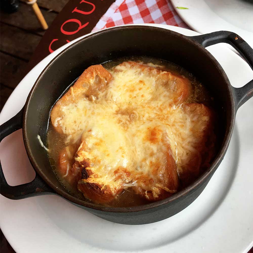 french onion soup at a bistro in paris
