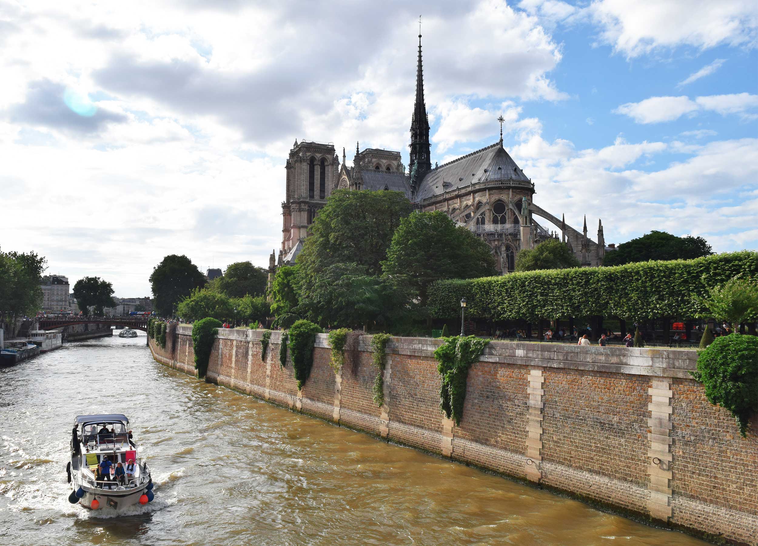 backside of notre dame in paris before fire in 2018 and seine river