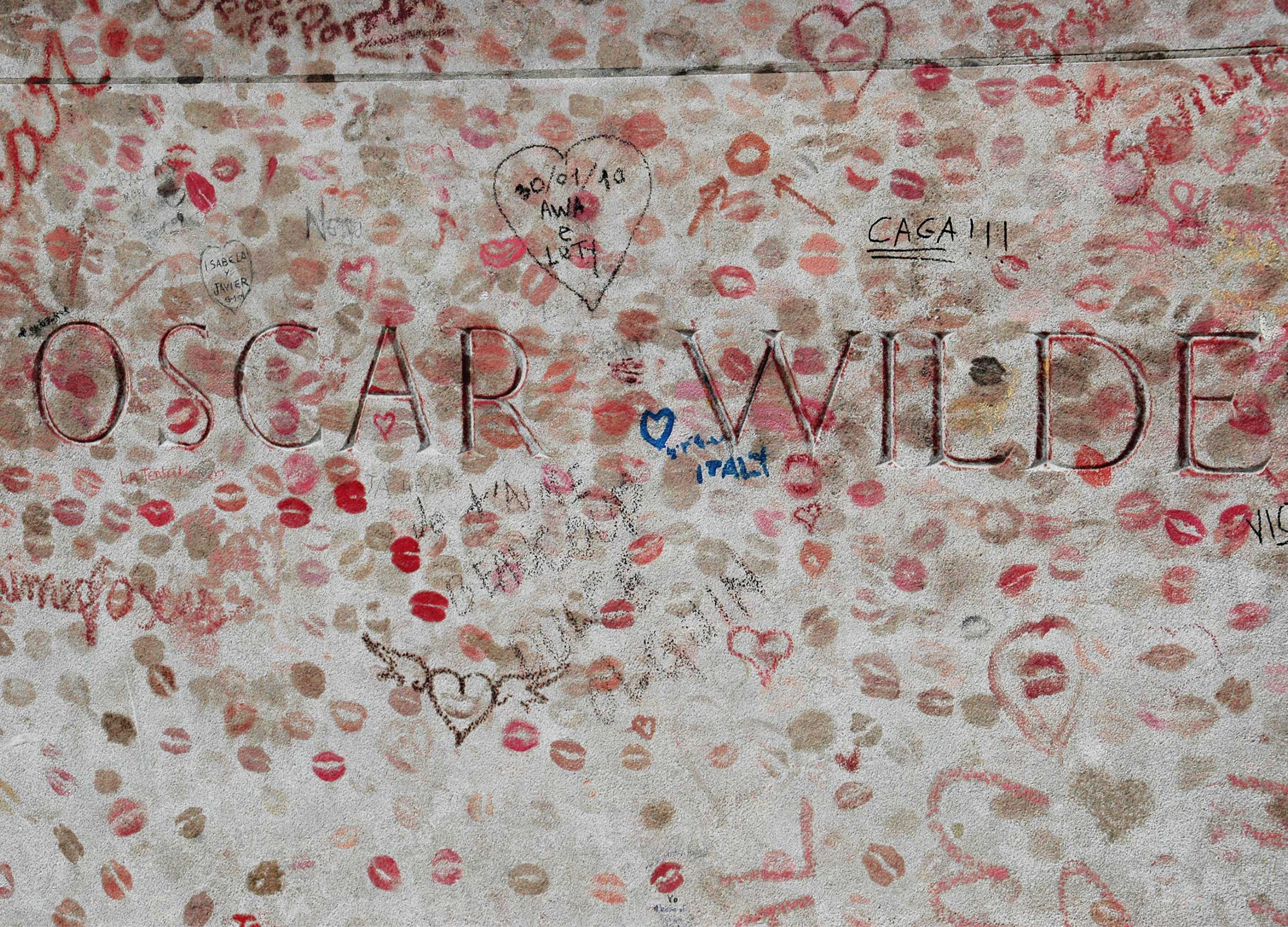 Oscar Wilde gravesite at pere lachaise cemetary, Paris. Grave is filled with lipstick kisses.